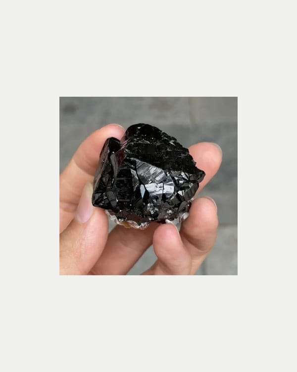 Complete right oblique view of lustrous cassiterite with mica
