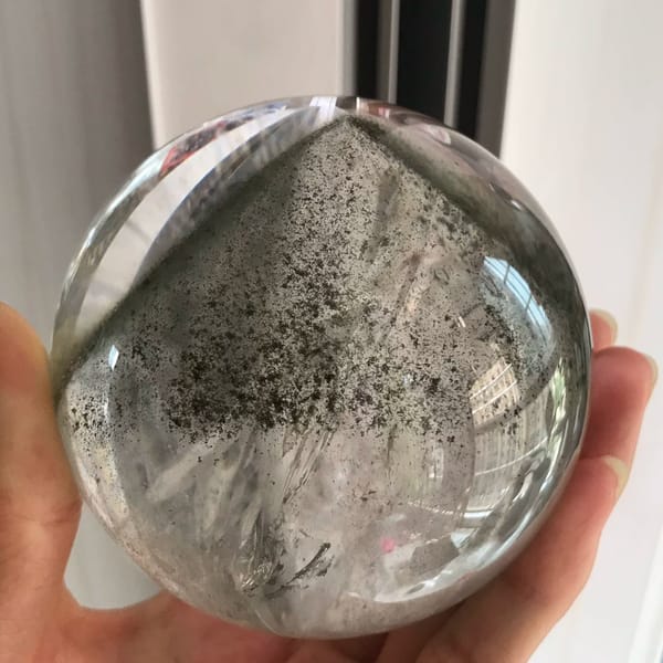 Clear quartz sphere with a pyramid green phantom from Brazil — complete view