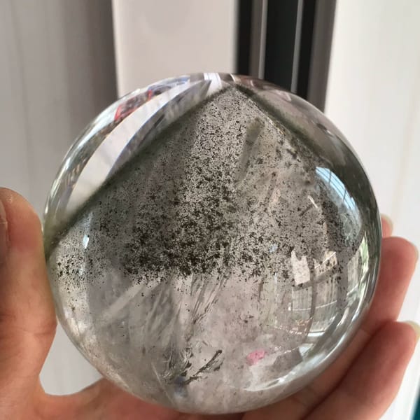 Clear quartz sphere with a pyramid green phantom from Brazil — alternate view