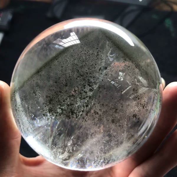 Clear quartz sphere with a pyramid green phantom from Brazil — alternate view