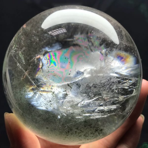 Clear quartz sphere with a pyramid green phantom from Brazil — detail view