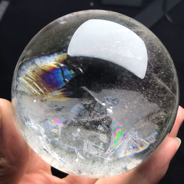 Clear quartz sphere with a pyramid green phantom from Brazil — detail view