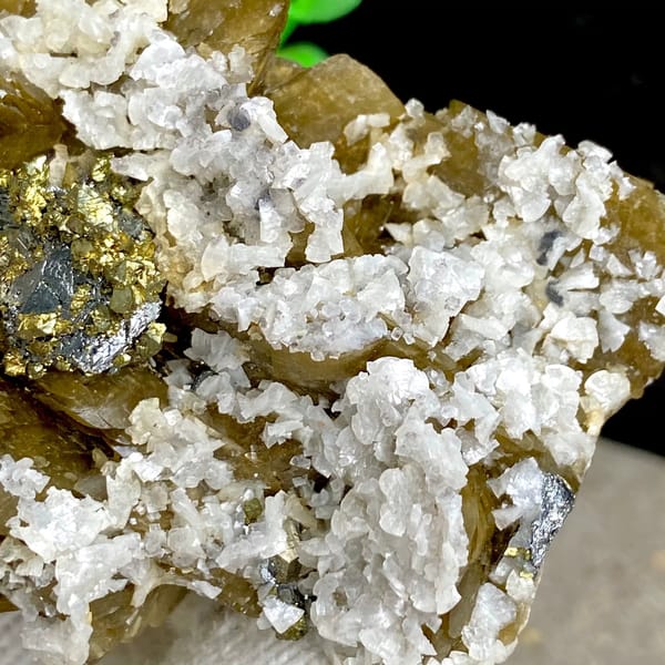 Chalcopyrite and tetrahedrite on golden siderite with white dolomite — detail view