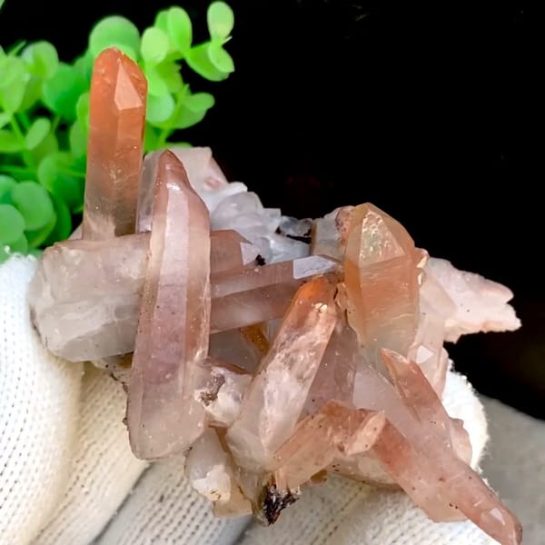 Spiky cluster of red-pink hematoid quartz points — complete view