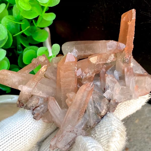 Spiky cluster of red-pink hematoid quartz points — alternate view
