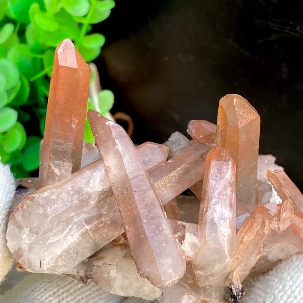 Spiky cluster of red-pink hematoid quartz points — alternate view