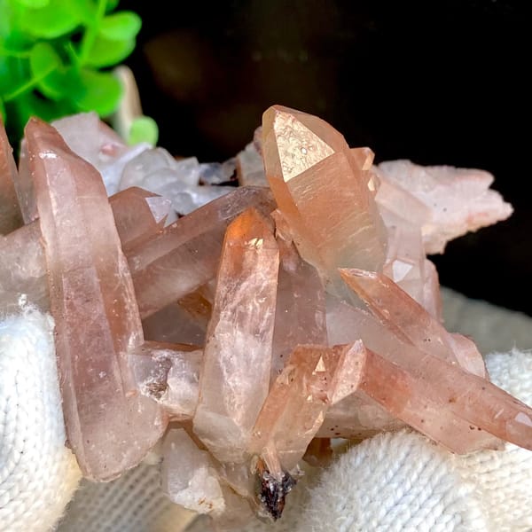 Spiky cluster of red-pink hematoid quartz points — detail view