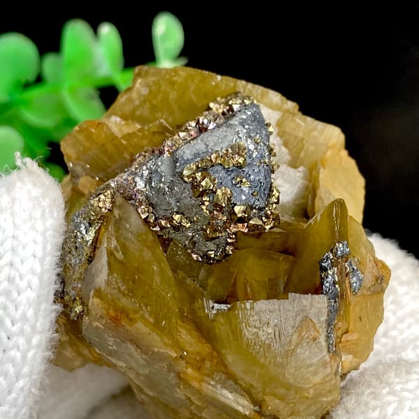Grey tetrahedrite and brassy chalcopyrite in golden-brown siderite — detail view