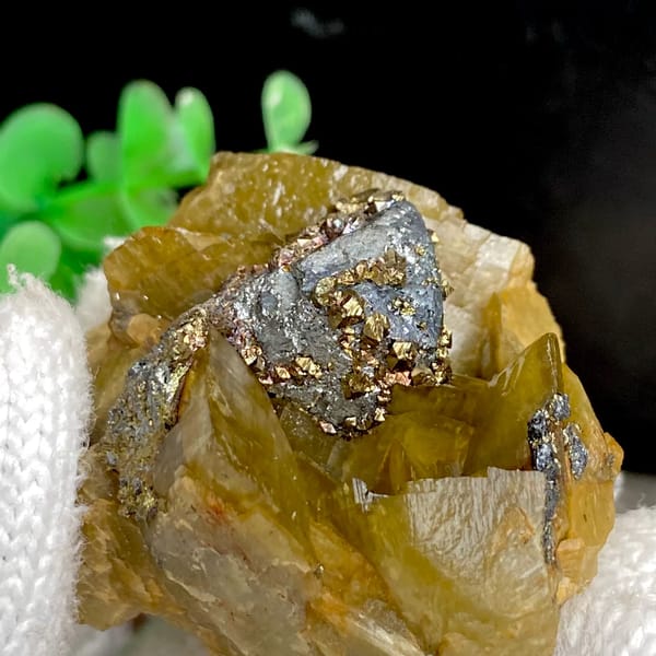 Grey tetrahedrite and brassy chalcopyrite in golden-brown siderite — detail view