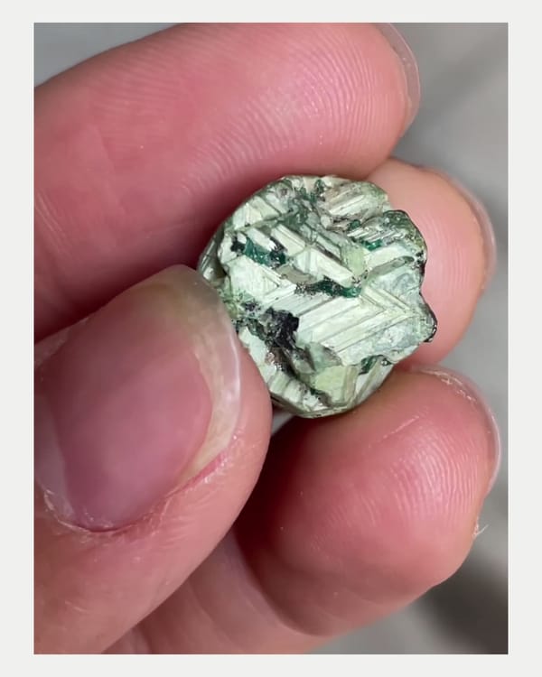 Complete front view of green mushistonite over kesterite