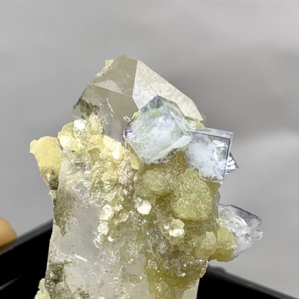 Quartz point dotted with pale blue-green fluorite from Yaogangxian — alternate view