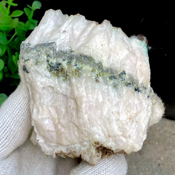 Turquoise chrysocolla among smoky quartz crystals — detail view