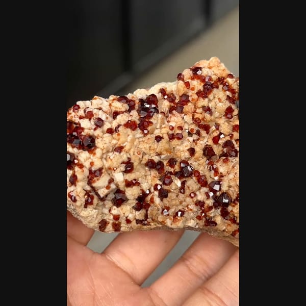Wine-red garnet with feldspar from Yunxiao — complete view
