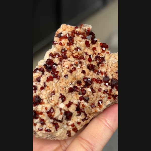 Wine-red garnet with feldspar from Yunxiao — alternate view