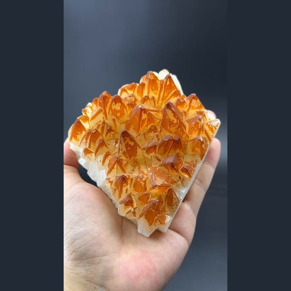 Golden orange calcite crystal cluster — complete view