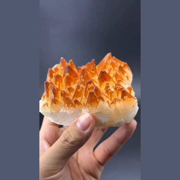 Golden orange calcite crystal cluster — detail view