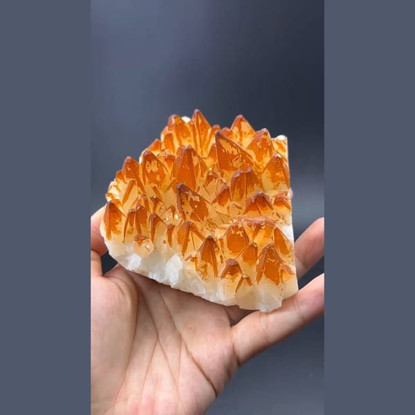 Golden orange calcite crystal cluster — detail view