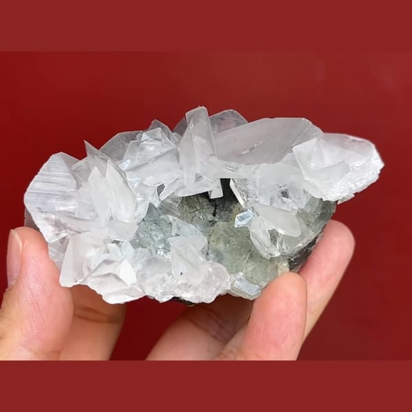 Pale green fluorite with white bladed calcite from Xianghuapu, Hunan — alternate view