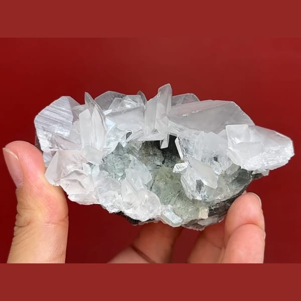 Pale green fluorite with white bladed calcite from Xianghuapu, Hunan — detail view