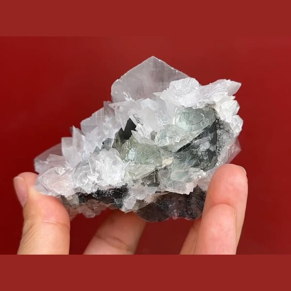 Pale green fluorite with white bladed calcite from Xianghuapu, Hunan — detail view
