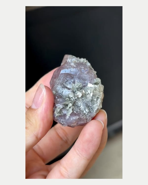 Complete reverse view of large purple apatite with mica