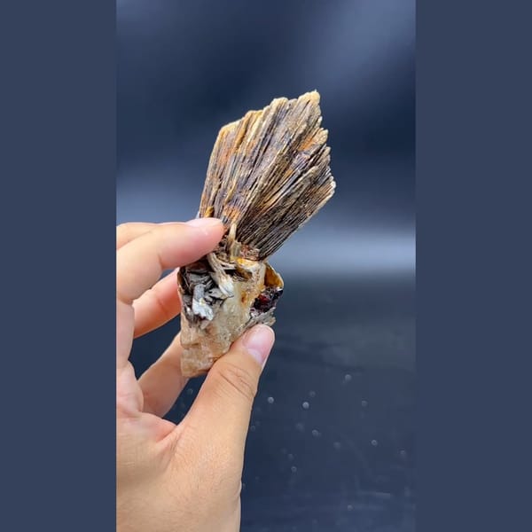 Stacked layered mica books with garnet and feldspar from Pakistan — alternate view