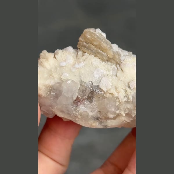 Topaz crystal on platy white cleavelandite from Pakistan — complete view
