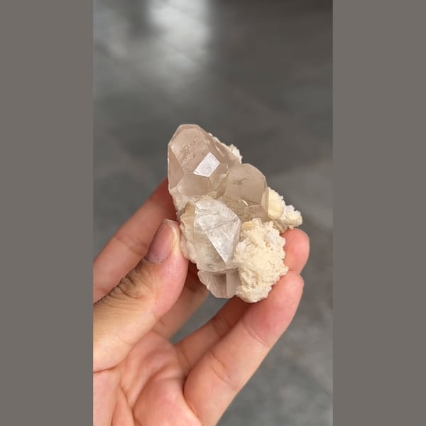 Topaz crystal on platy white cleavelandite from Pakistan — alternate view