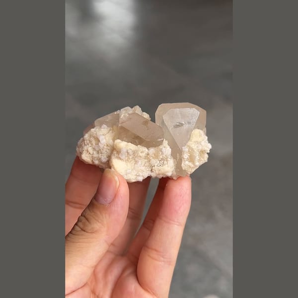 Topaz crystal on platy white cleavelandite from Pakistan — alternate view