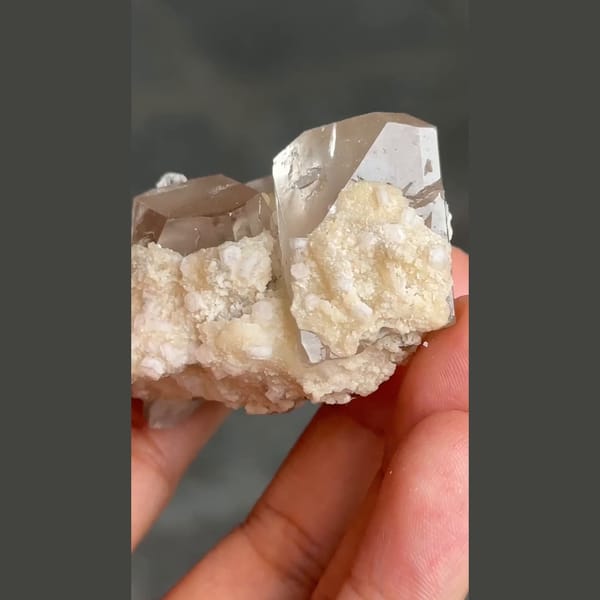 Topaz crystal on platy white cleavelandite from Pakistan — detail view
