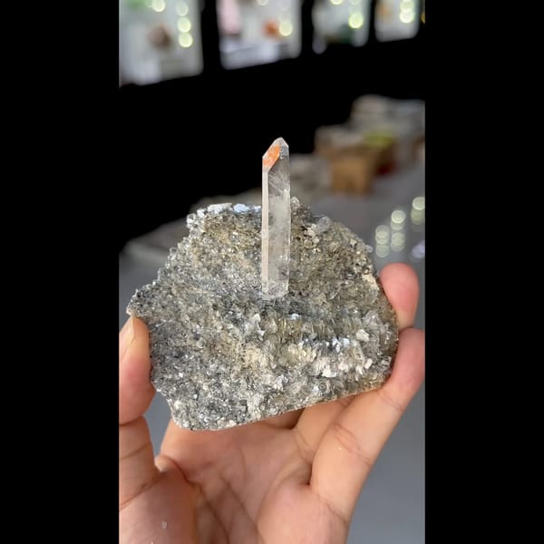 Slender clear quartz crystal on silvery mica from Xuebaoding, Sichuan — alternate view