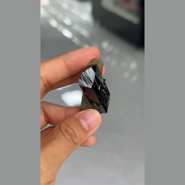 Lustrous striated black ilvaite crystals with quartz from Inner Mongolia — alternate view