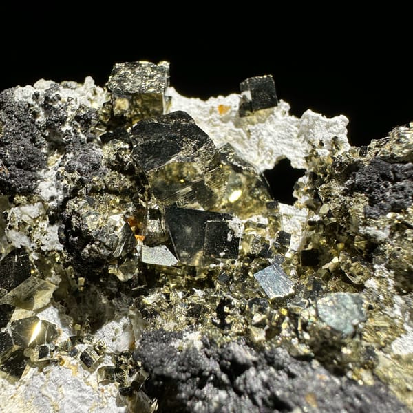 Brassy pyrite cubes with dark marmatite from Shangbao — alternate view