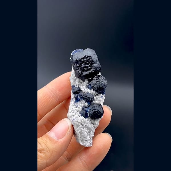 Dark blue cubic fluorite crystals on white quartz from Inner Mongolia — complete view