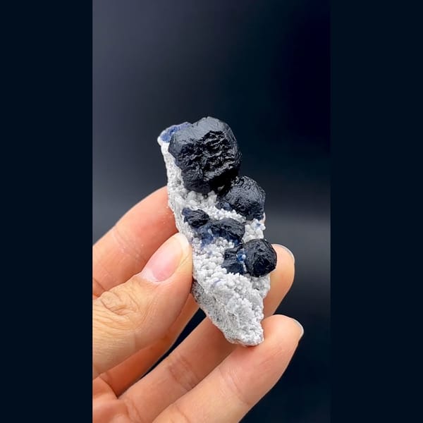 Dark blue cubic fluorite crystals on white quartz from Inner Mongolia — alternate view