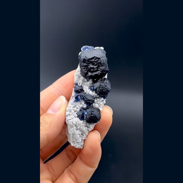 Dark blue cubic fluorite crystals on white quartz from Inner Mongolia — detail view