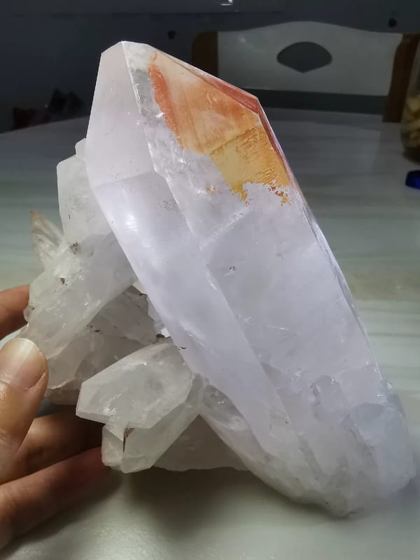 Complete reverse view showing the large red-tipped quartz crystal