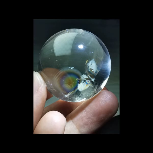 Rainbow clear quartz sphere, 38.5 mm — complete view