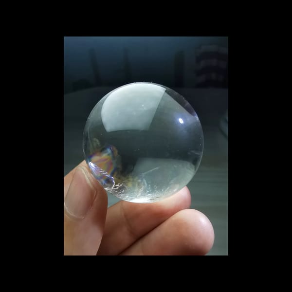 Rainbow clear quartz sphere, 38.5 mm — detail view