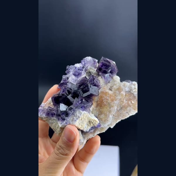 Purple phantom fluorite cubes on pale matrix from Anhui — complete view