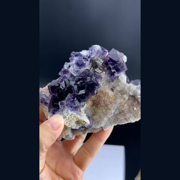 Purple phantom fluorite cubes on pale matrix from Anhui — alternate view