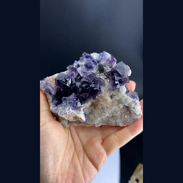 Purple phantom fluorite cubes on pale matrix from Anhui — alternate view