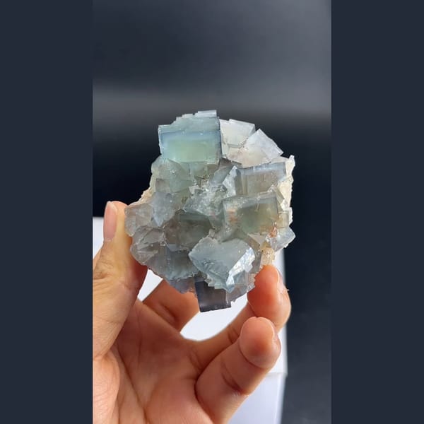 Soft blue cubic fluorite cluster from Tanghekou, Beijing — complete view