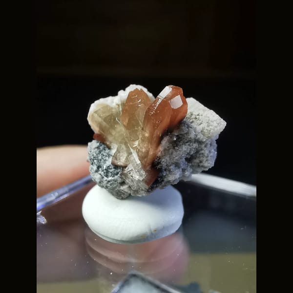 Wine-red topaz crystals on matrix from Mexico — alternate view