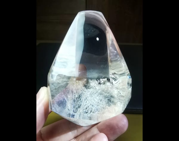 Complete front view of the polished clear quartz freeform and frosted base