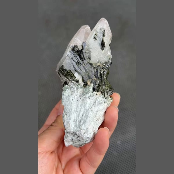 Dark green epidote sprays on white calcite from Pakistan — complete view