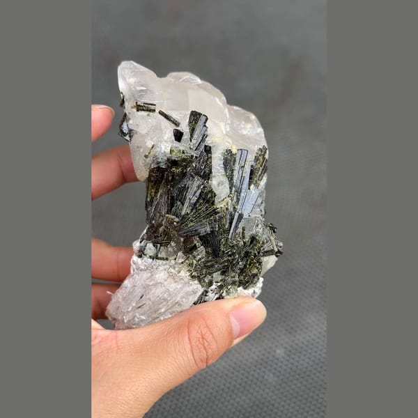 Dark green epidote sprays on white calcite from Pakistan — alternate view