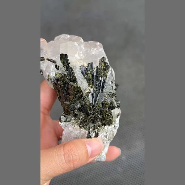 Dark green epidote sprays on white calcite from Pakistan — alternate view