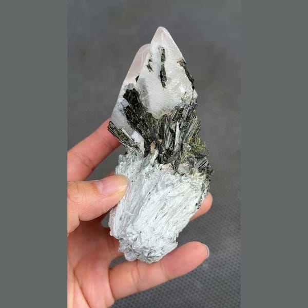 Dark green epidote sprays on white calcite from Pakistan — detail view