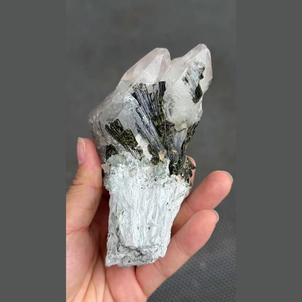 Dark green epidote sprays on white calcite from Pakistan — detail view